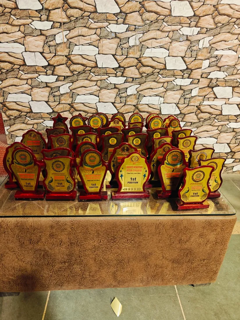 Trophies arranged on a table ready for presentation to students