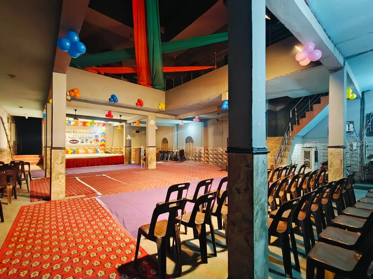 Decorated pillars and ceiling of the school hall prepared for an event